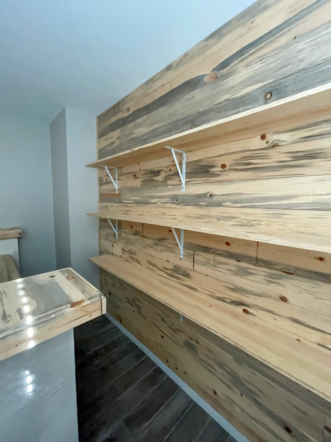 White painted shiplap accent wall in a Phoenix living room that brightens the space without adding glare