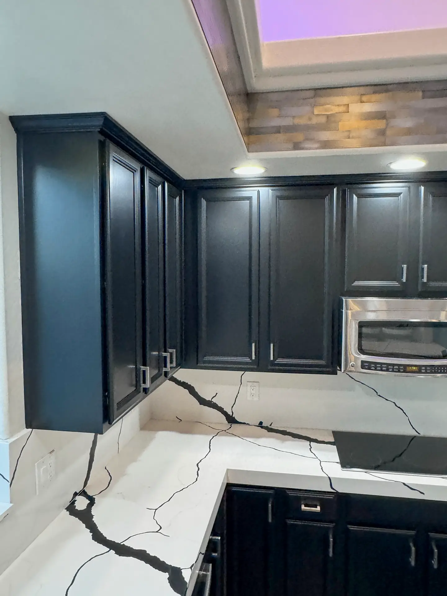 The same Phoenix cabinets after refinishing with a smooth sprayed finish that looks like new millwork