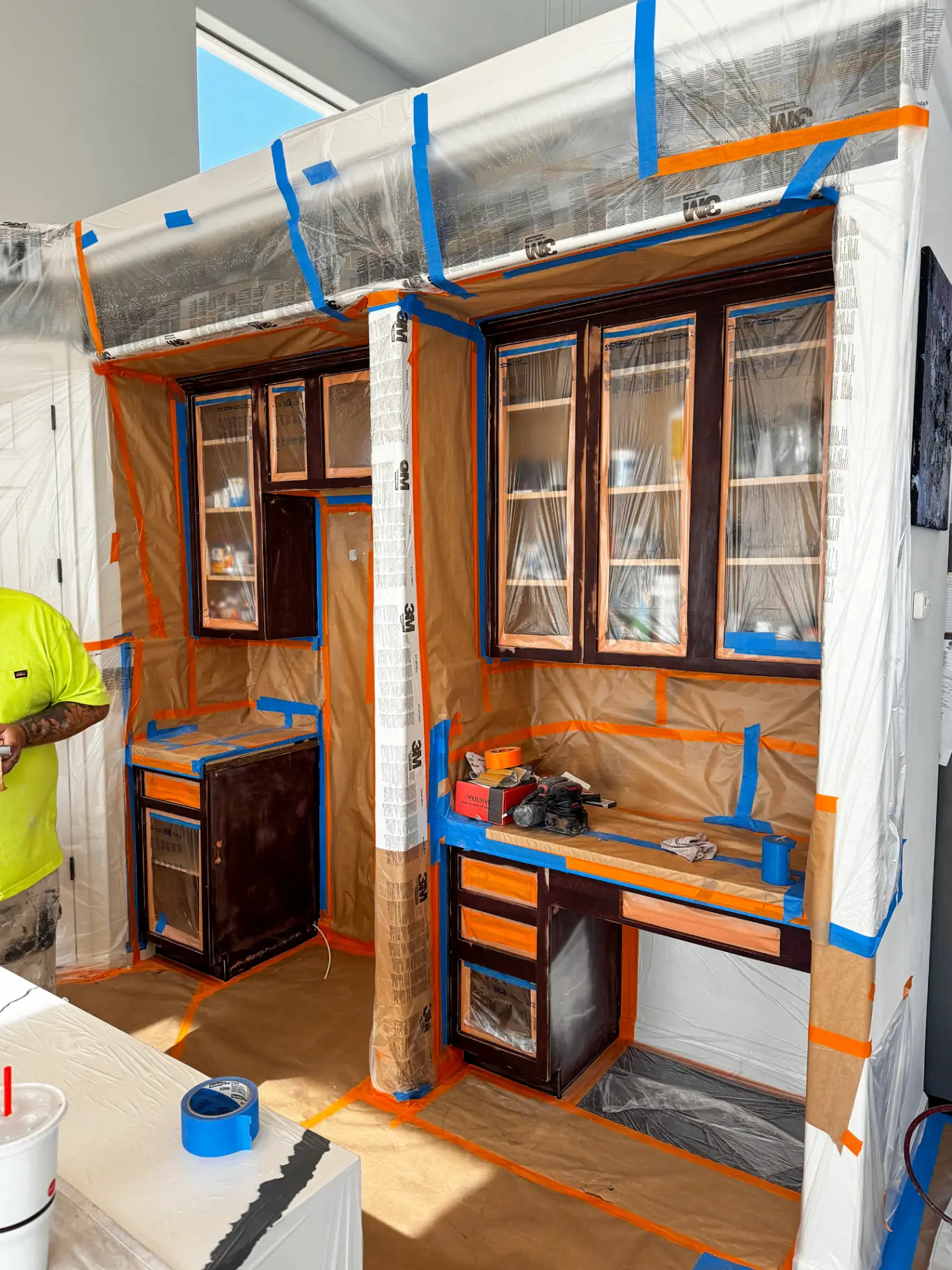 Phoenix office cabinets before refinishing with worn orange toned wood and chipped edges