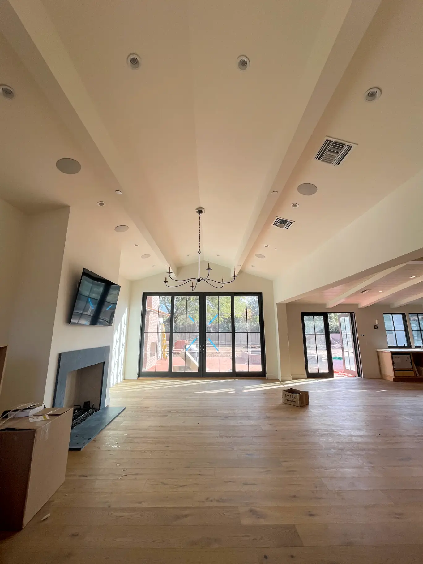 Scottsdale luxury living room repainted in a soft warm neutral that makes the high ceilings feel even taller