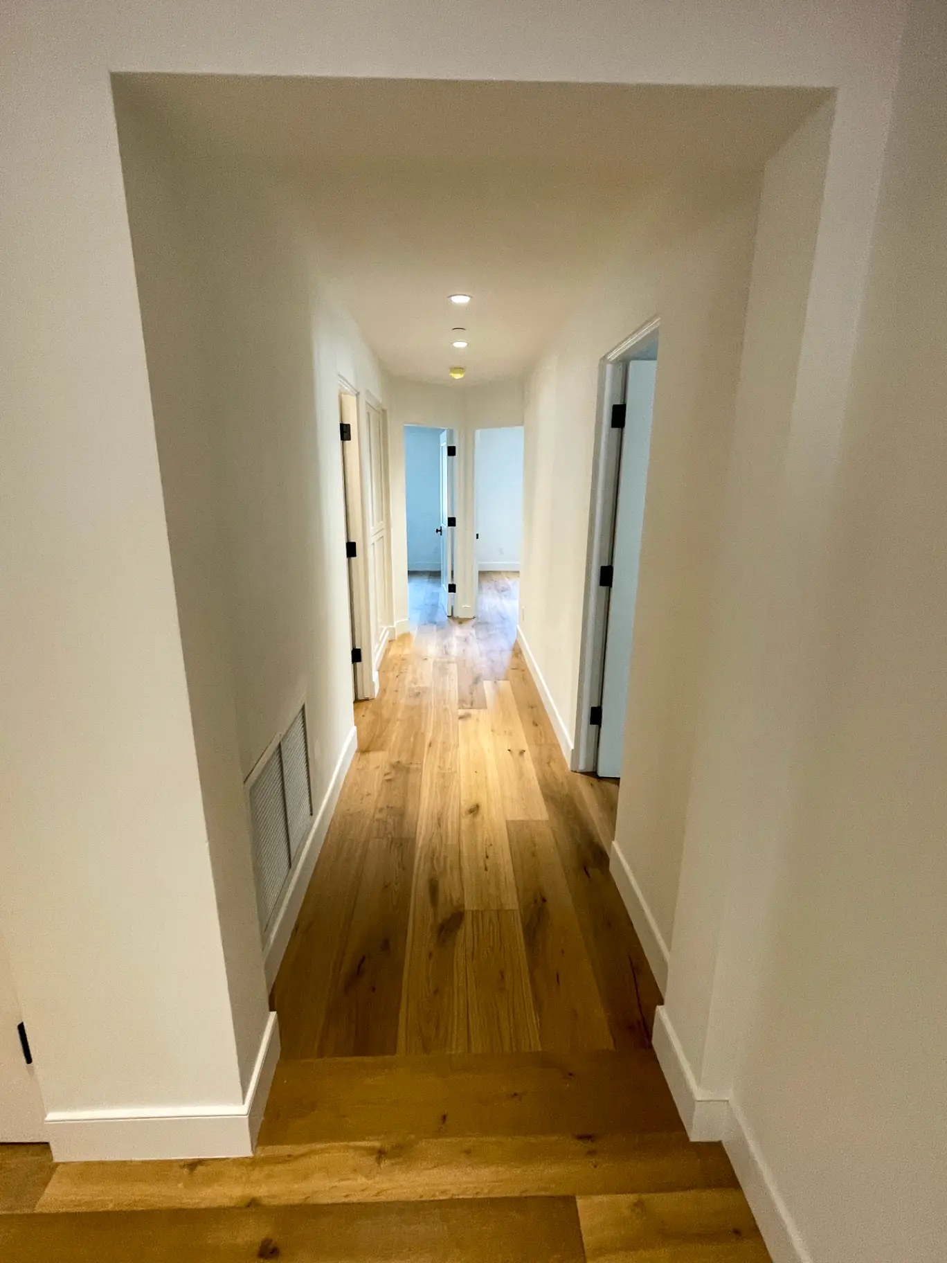 Scottsdale hallway with freshly painted doors and trim in a scrubbable enamel built for high traffic
