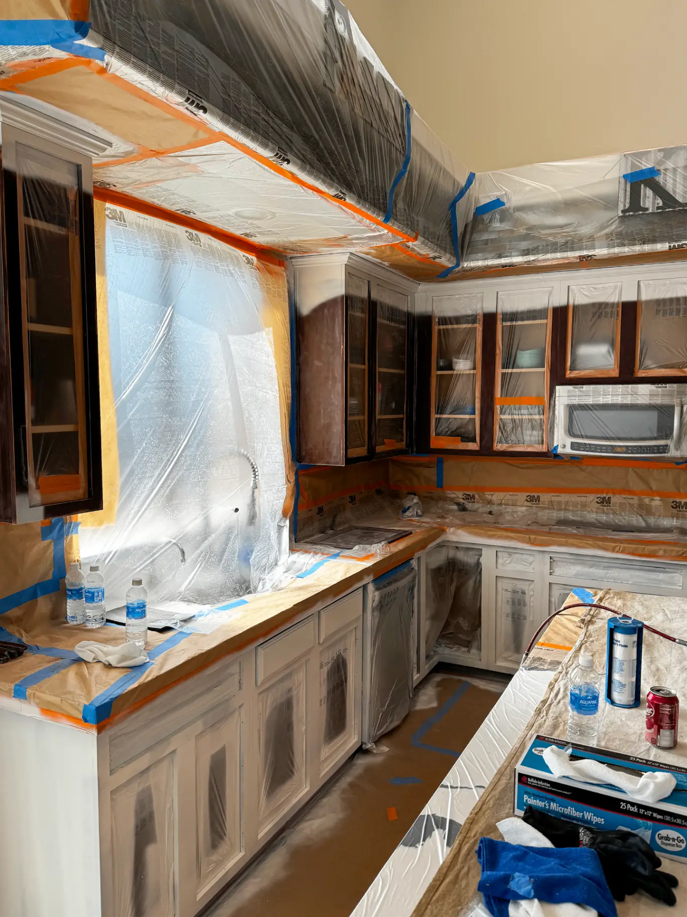Gilbert kitchen sink wall before painting with tired beige walls and dull backsplash